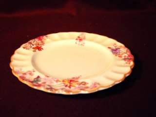   bread and butter dish in the Chelsea pattern with the mustard rim