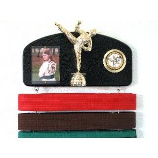 Martial arts belt display with a KICK  Midn. trophy male.