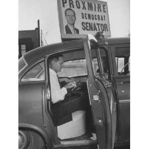  Politician William E. Proxmire Working in His Car During 