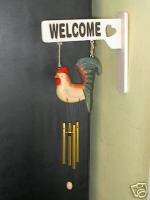 Wooden Welcome Sign with Chicken and Wind Chimes  